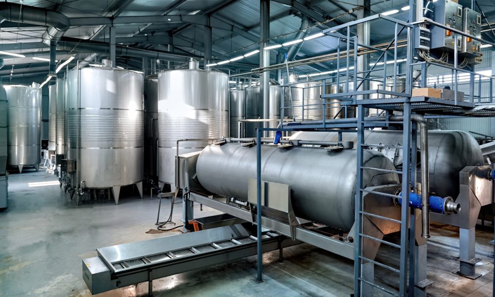 Metal wine storage tanks in a winery Metal wine storage tanks in a winery. Wide shot